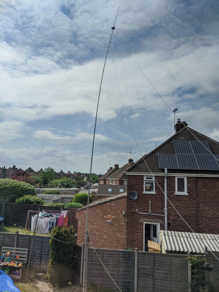 A picture of the antenna and pole in the garden.